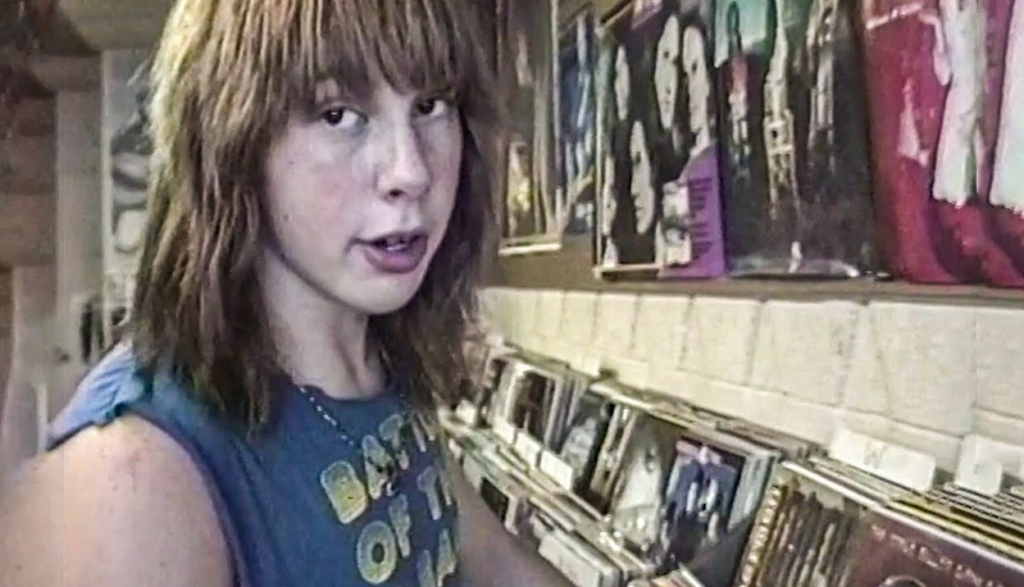 Two metalhead teens in a record store