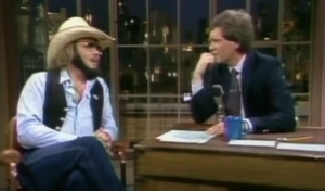 Hank Williams Jr. Visits with David Letterman in 1982 and Sings A Country Boy Can Survive